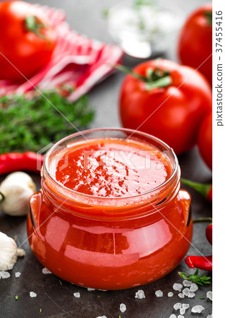 Tomato paste, puree in glass jar and fresh tomatos 37455416