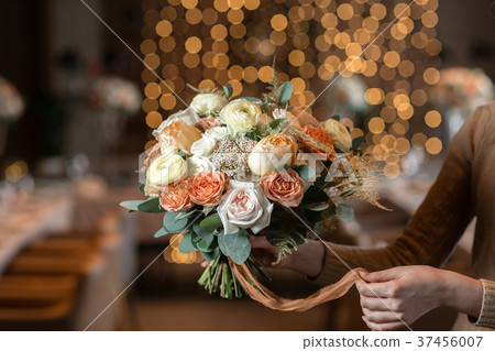 beautiful luxury bouquet of mixed flowers in woman 37456007