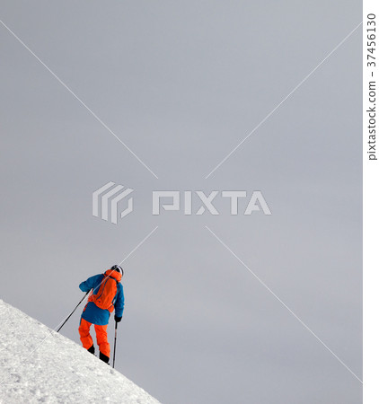 Skier before downhill on snowy freeride slope 37456130