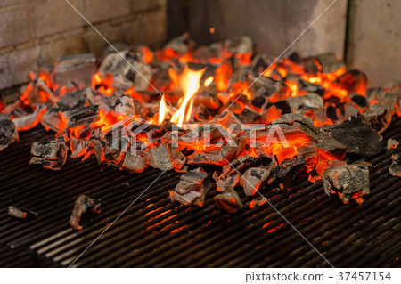 Typical Argentinian barbecue or asado. Burning Typical Argentinian barbecue or asado. Burning 37457154