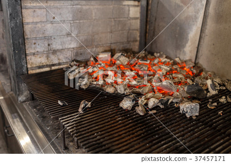 Typical Argentinian barbecue or asado. Burning Typical Argentinian barbecue or asado. Burning 37457171