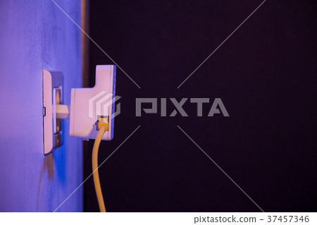 WiFi extender in electrical socket on the wall WiFi extender in electrical socket on the wall 37457346