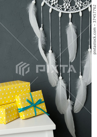 White crochet doily dream catcher on dark gray 37457762