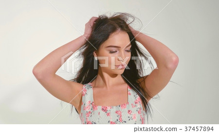 Portrait of beautiful young woman at studio on the 37457894