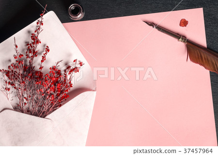 Envelope with flowers on a paper and a quill pen Envelope with flowers on a paper and a quill pen 37457964