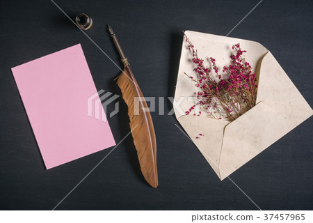 Feather pen and a paper sheet with an envelope Feather pen and a paper sheet with an envelope 37457965