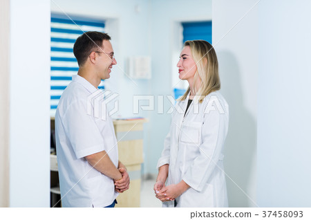 Two Male and Female Doctors or Nurses Standing 37458093