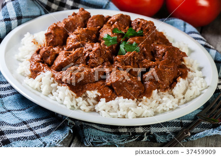 Chicken tikka masala served with rice Chicken tikka masala served with rice 37459909