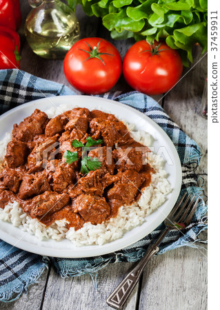 Chicken tikka masala served with rice Chicken tikka masala served with rice 37459911