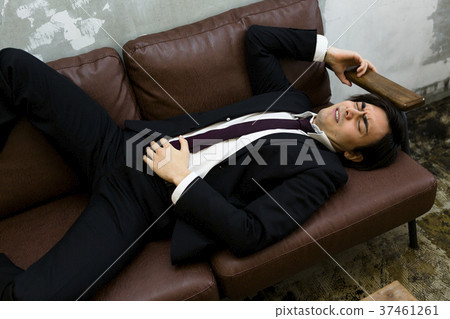 A man sleeping on the sofa 37461261