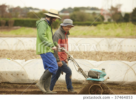 Farmer and foreign man cultivator 37464853