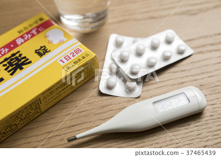 Cold medicine and thermometer and water Cold medicine and thermometer and water 37465439