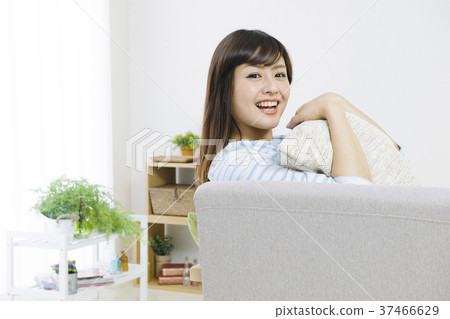 Young woman relaxing on the couch 37466629