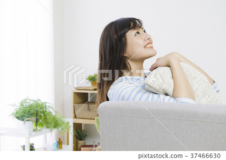 Young woman relaxing on the couch 37466630