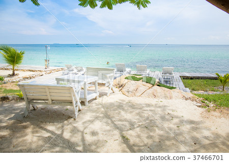 Wooden chair and white table for relaxing. Wooden chair and white table for relaxing. 37466701