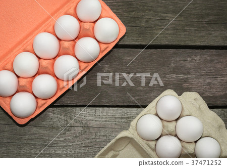 Carton of organic eggs on wooden background. Carton of organic eggs on wooden background. 37471252