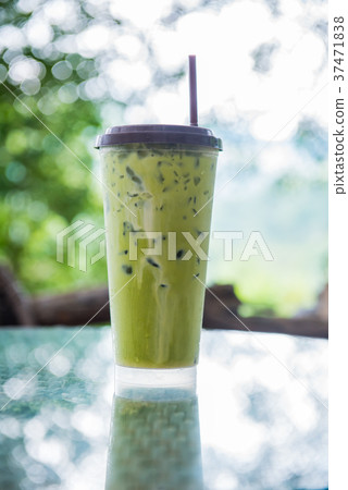 ice green tea on table with garden background 37471838