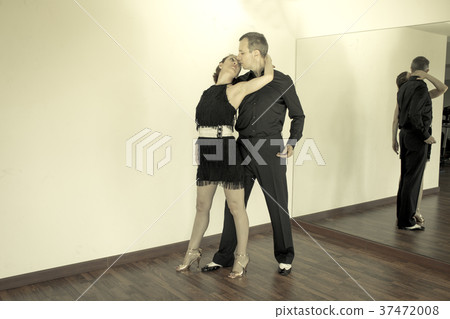 Couple of dancers dancing latin dances Couple of dancers dancing latin dances 37472008