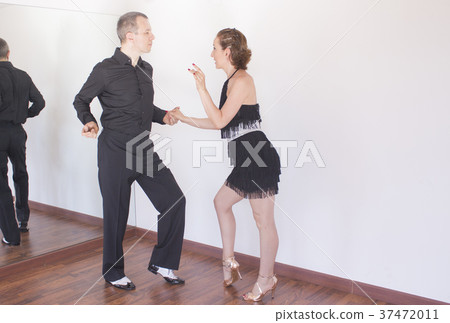 Couple of dancers dancing latin dances 37472011