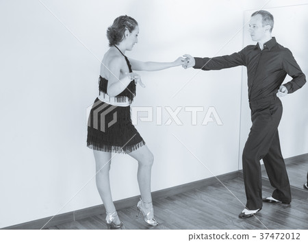Couple of dancers dancing latin dances Couple of dancers dancing latin dances 37472012