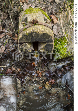 Front view of the old natural wellhead covered by 37472251