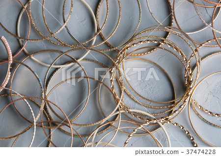 Many bracelets on gray 37474228