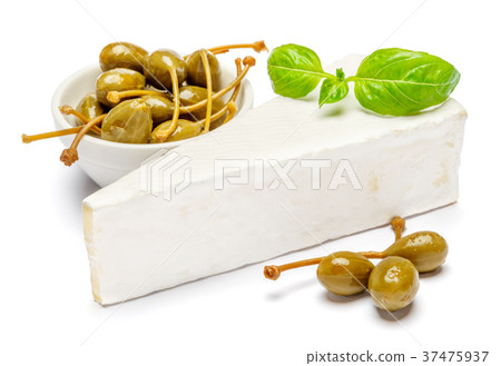 Piece of brie or camambert cheese and capers on a 37475937
