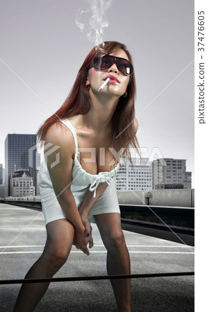 woman smoking cigarette woman smoking cigarette 37476605