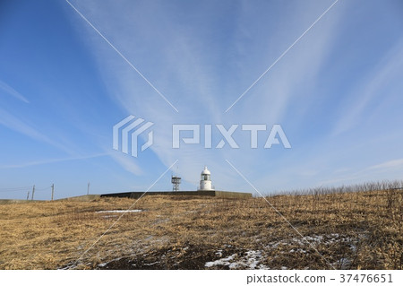 Winter's cape lighthouse and blue sky seen from a distance 37476651