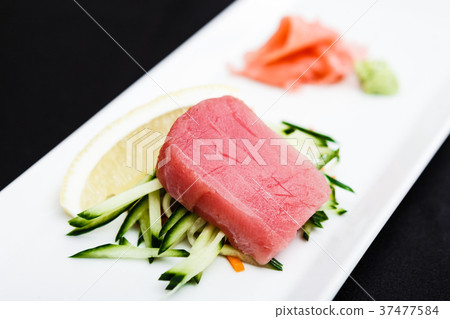 Tuna sashimi served on a plate Tuna sashimi served on a plate 37477584