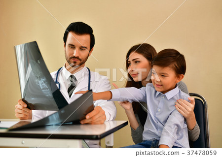 Health Concepts. Doctor and patient viewing x-ray film. The doct 37478059