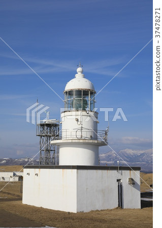Winter cape lighthouse and blue sky Winter cape lighthouse and blue sky 37478271