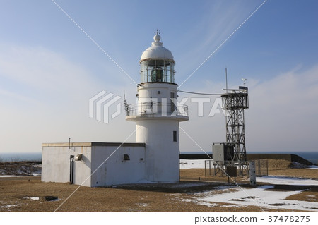 Winter cape lighthouse and blue sky 37478275