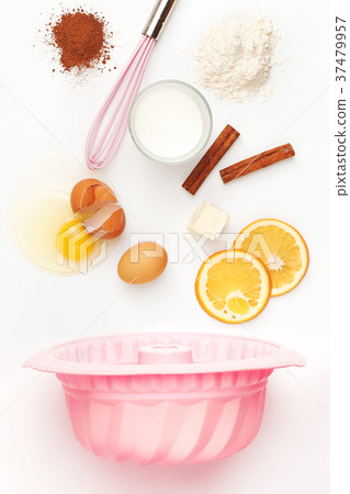 The falling ingredients of pie or cake on white 37479957