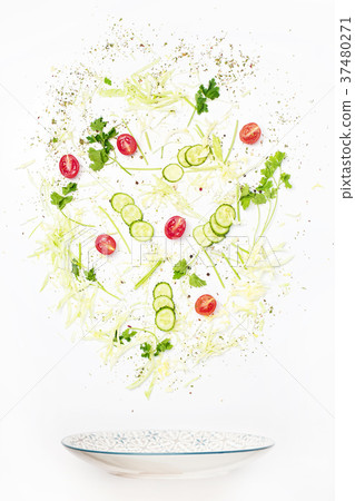 The salad bowl in flight with vegetables: tomato The salad bowl in flight with vegetables: tomato 37480271