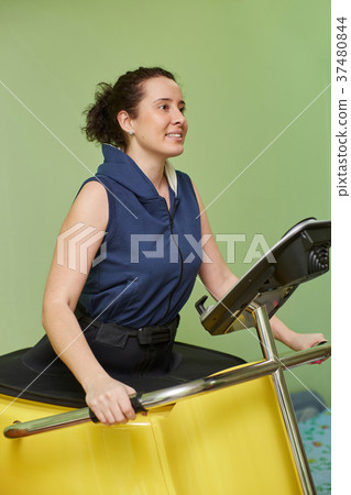 Woman doing vacuum training and body sculpting 37480844