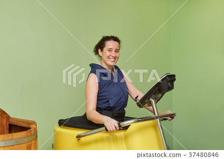 Woman doing vacuum training and body sculpting 37480846