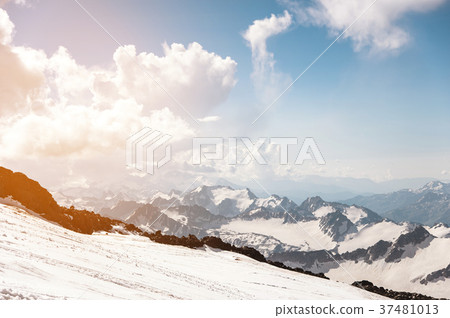 Dark blue sky with clouds on the rocky peaks of Dark blue sky with clouds on the rocky peaks of 37481013