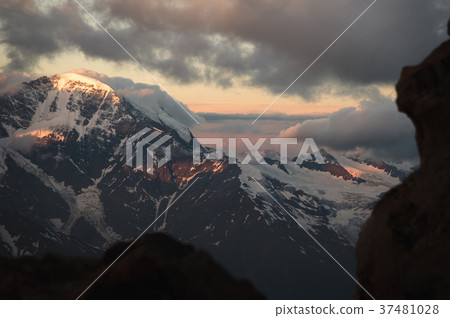 Sunset panorama of the elbrus and part of the 37481028