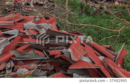 Broken roof tiles are waiting to destroy. Broken roof tiles are waiting to destroy. 37482995