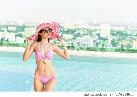 Swimsuit Concept. Beautiful girl wearing pink swimsuit. Beautifu 37486963