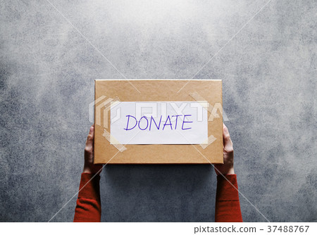 Donation Concept. Woman holding a Donate Box Donation Concept. Woman holding a Donate Box 37488767