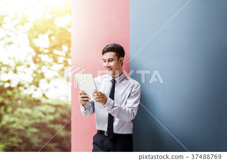 Happy Businessman Enjoying or Working on Table Happy Businessman Enjoying or Working on Table 37488769