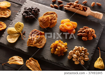 Dried fruits and nuts on slate plate Dried fruits and nuts on slate plate 37491845
