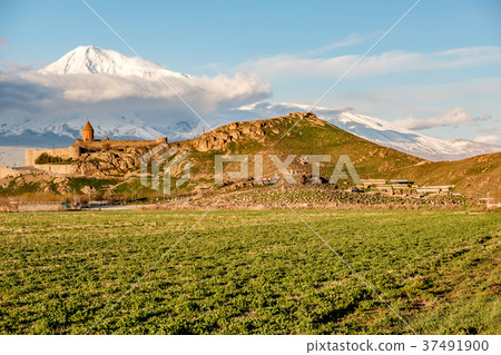 Ancient monastery in front of mountain 37491900