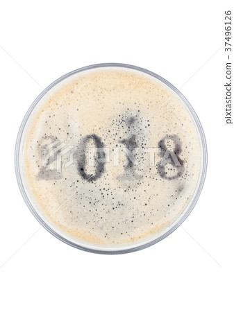 Glass of stout beer top with 2018 year digits 37496126