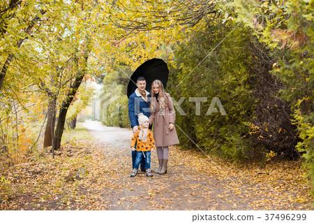 family walk in the autumn forest in the Park in family walk in the autumn forest in the Park in 37496299
