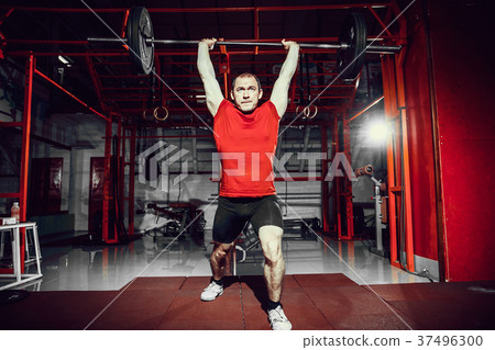 Muscular fitness man doing deadlift a barbell over Muscular fitness man doing deadlift a barbell over 37496300