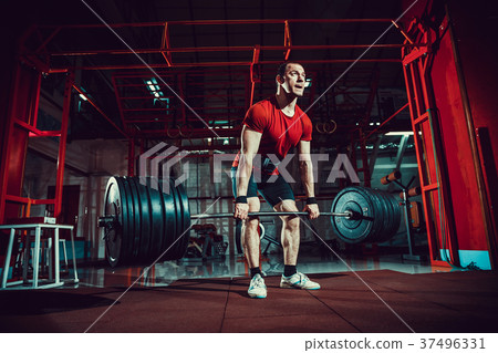Muscular fitness man doing deadlift a barbell in Muscular fitness man doing deadlift a barbell in 37496331