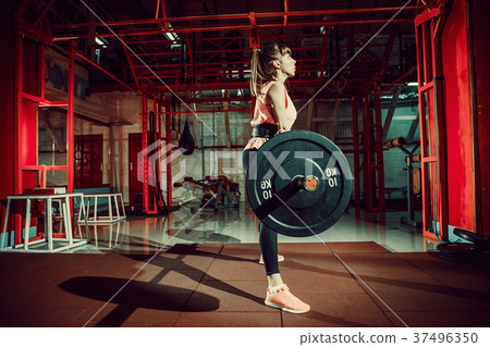 Female fitness performing doing deadlift exercise Female fitness performing doing deadlift exercise 37496350